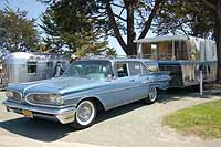 View vintage cars, trucks and station wagons pulling and towing vintage trailers